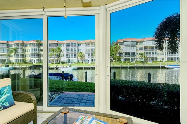 a kitchen with granite countertop a sink stainless steel appliances and cabinets
