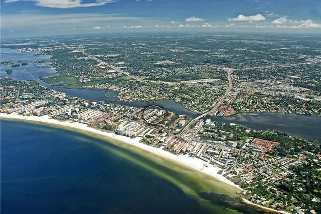a view of a swimming pool with a patio and a yard
