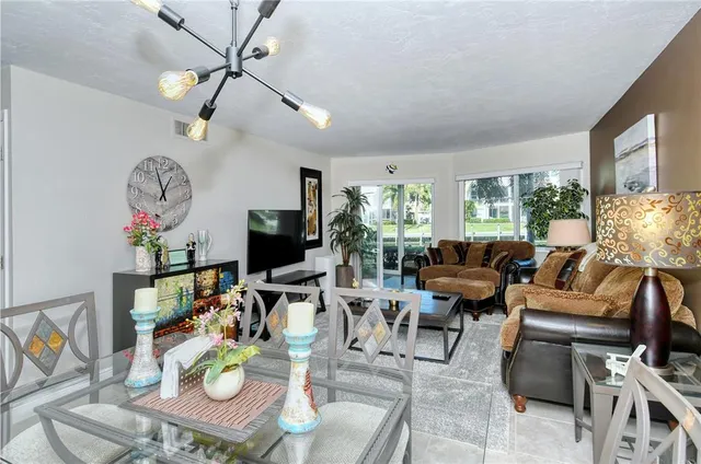 a dining room with furniture and window