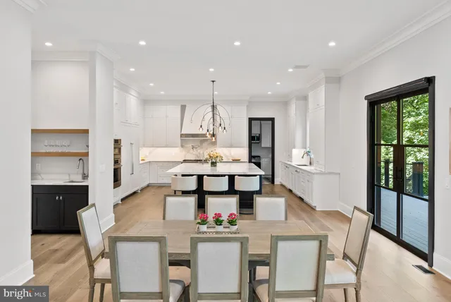 a kitchen with a table and chairs in it