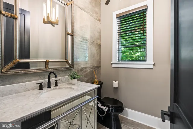 a balcony with furniture and a ceiling fan