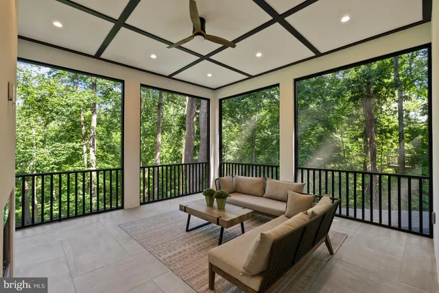 a view of a patio with table and chairs and wooden floor