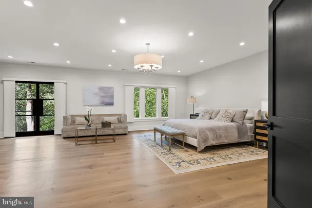 a spacious bedroom with a bed and a fireplace