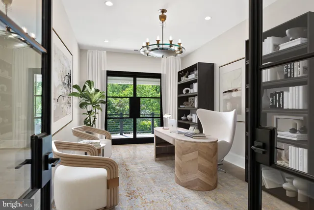 a view of a hallway with wooden floor and furniture