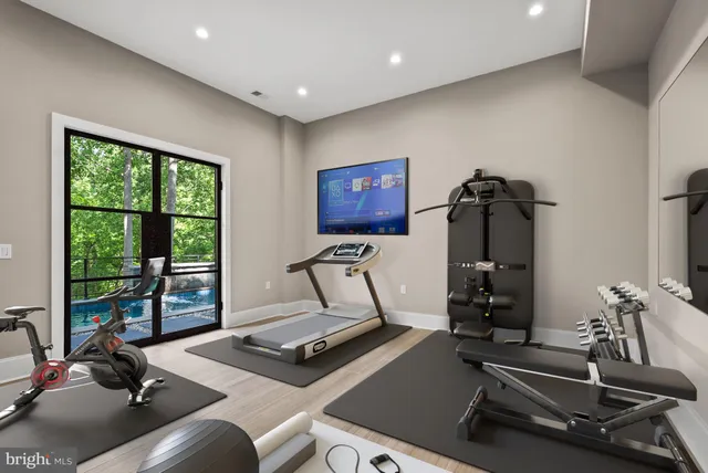 a view of staircase with furniture and a window