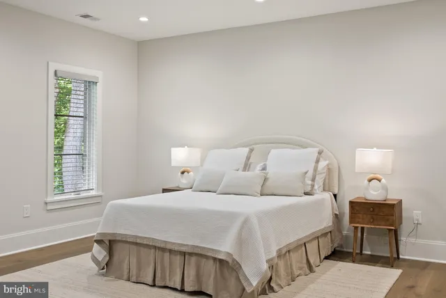 a bathroom with a toilet sink shower and mirror
