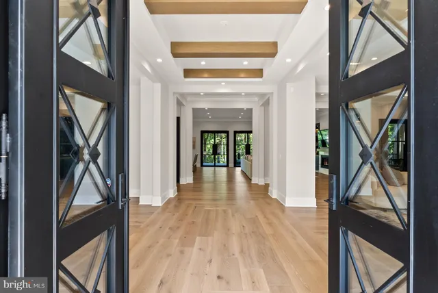 a view of an entryway with wooden floor