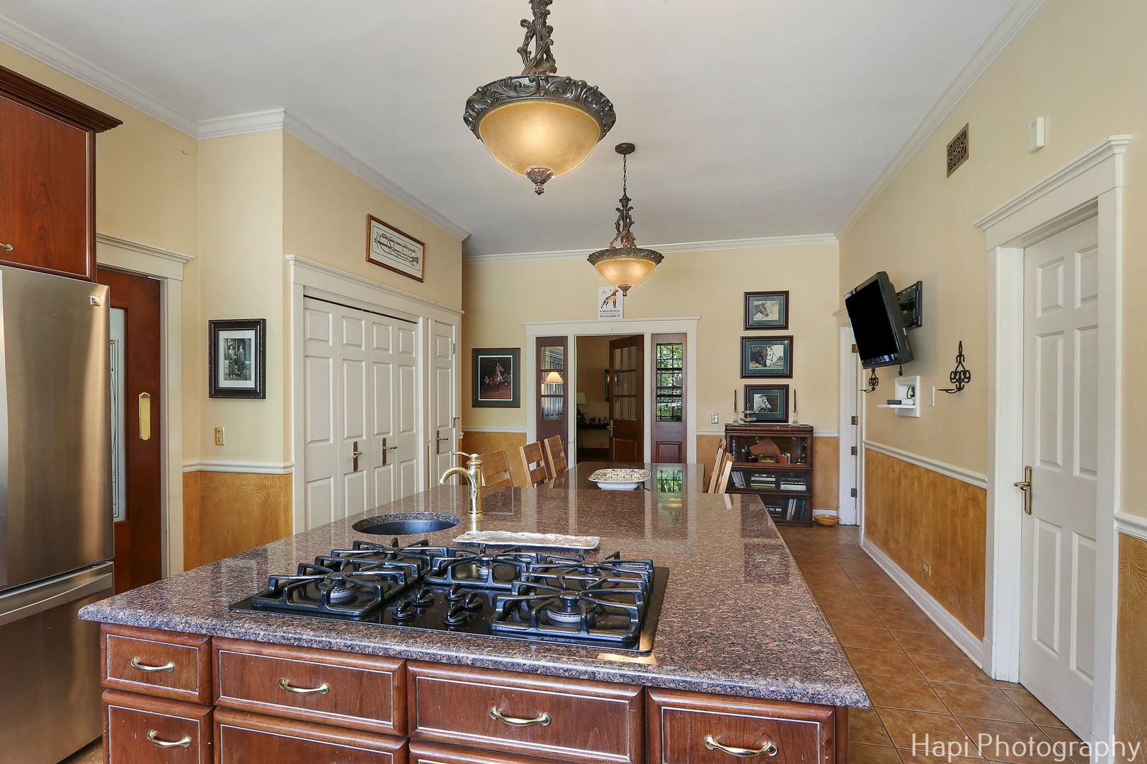 23 West County Line Road Barrington Hills, IL 60010 - Photo 19 of 71 a kitchen with stainless steel appliances granite countertop a stove refrigerator and cabinets