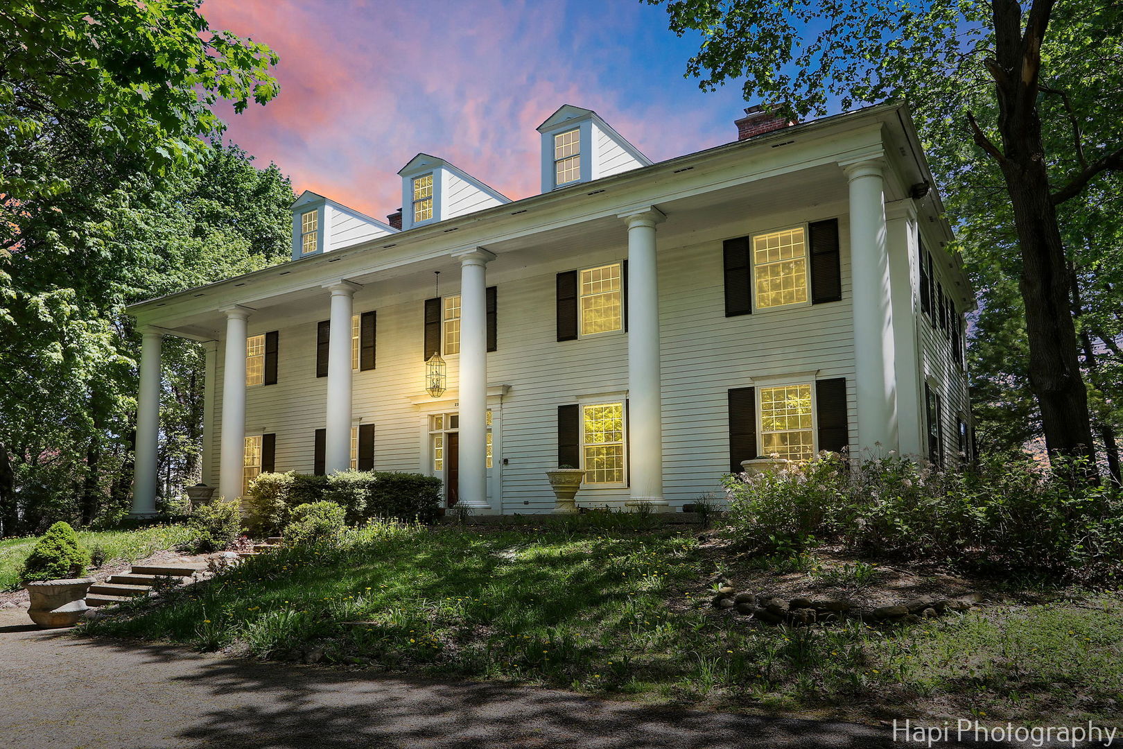 23 West County Line Road Barrington Hills, IL 60010 - Photo 2 of 71 a front view of a house with garden