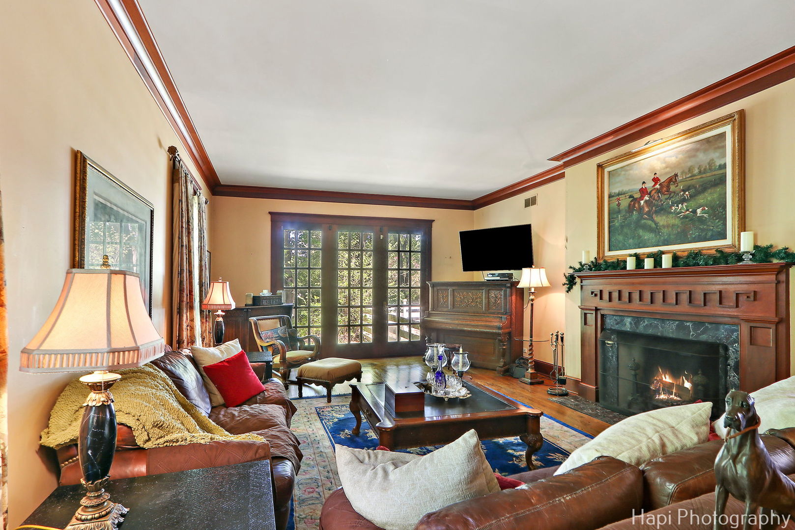 23 West County Line Road Barrington Hills, IL 60010 - Photo 23 of 71 a living room with furniture a flat screen tv and a fireplace