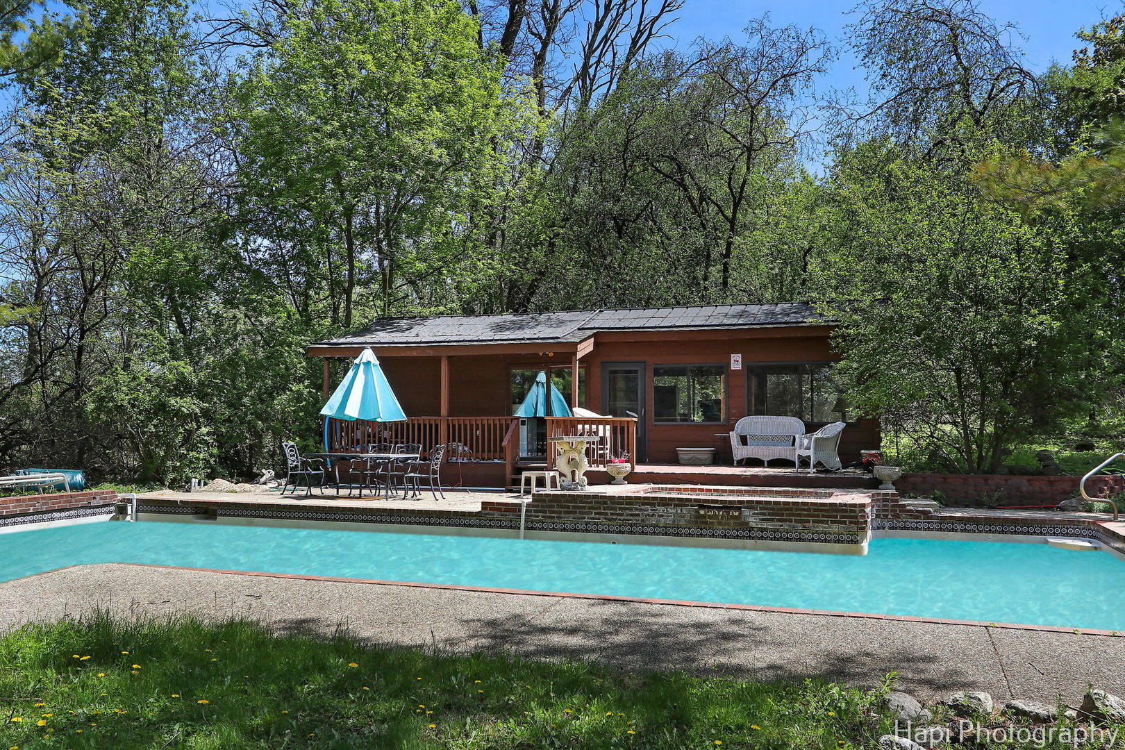 23 West County Line Road Barrington Hills, IL 60010 - Photo 47 of 71 a view of house with garden and tall trees