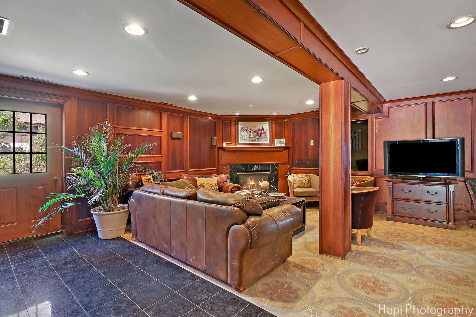 23 West County Line Road Barrington Hills, IL 60010 - Photo 57 of 71 a living room with furniture and a flat screen tv