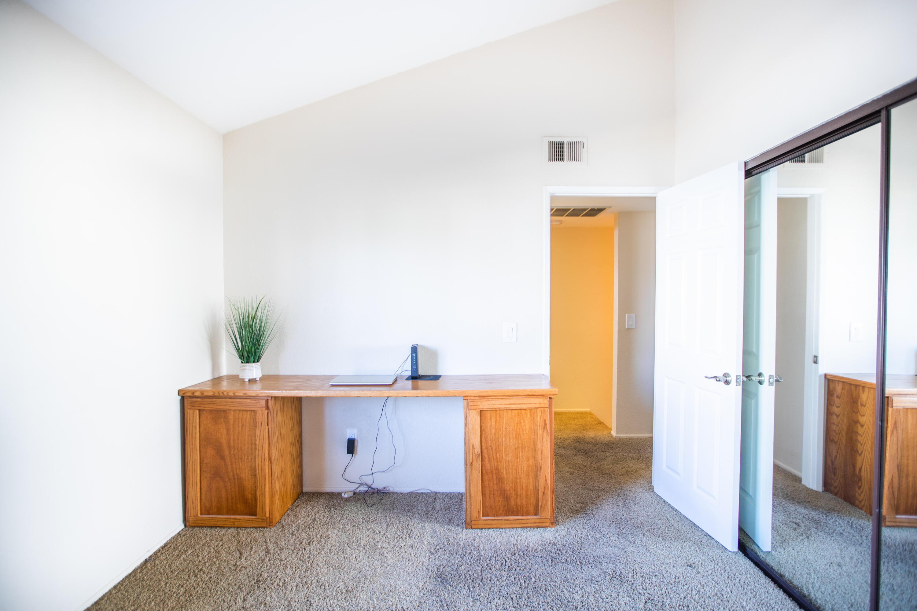 15261 Leffingwell Road, Unit 3 Whittier, CA 90604 - Photo 27 of 33 a view of a room with a fridge and wooden floor
