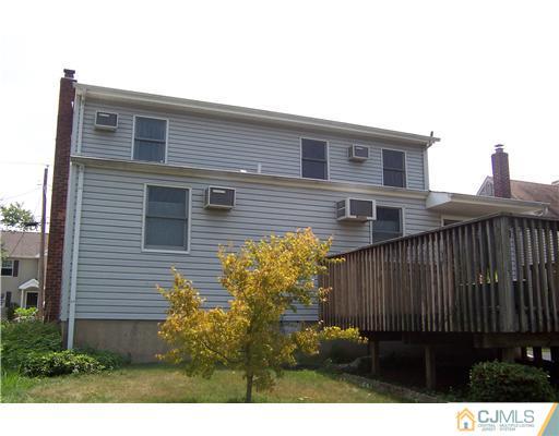 173 Midfield Road Colonia, NJ 07067 - Photo 2 of 25 a view of a house with a backyard