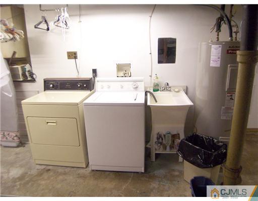 173 Midfield Road Colonia, NJ 07067 - Photo 20 of 25 a utility room with dryer and washer
