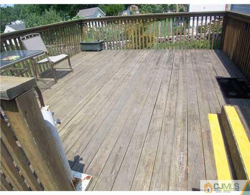 173 Midfield Road Colonia, NJ 07067 - Photo 21 of 25 a view of deck with wooden floor and outdoor seating