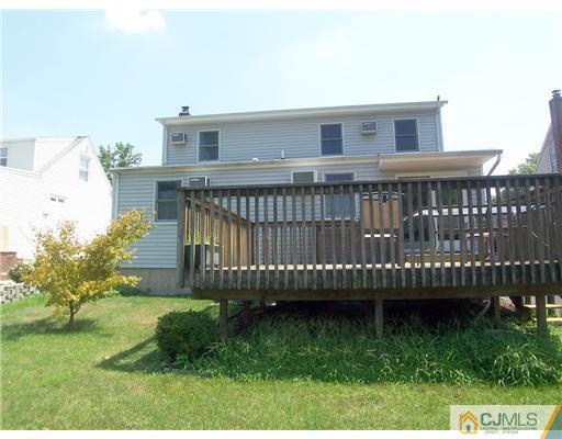 173 Midfield Road Colonia, NJ 07067 - Photo 25 of 25 a view of a house with a backyard