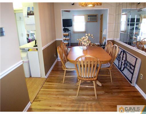 173 Midfield Road Colonia, NJ 07067 - Photo 5 of 25 a dining room with furniture window and wooden floor