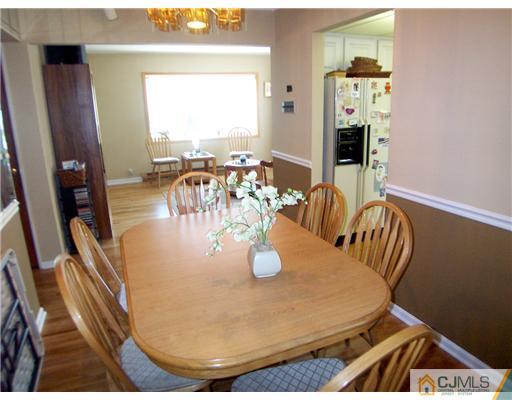 173 Midfield Road Colonia, NJ 07067 - Photo 6 of 25 a dining room with table and chairs