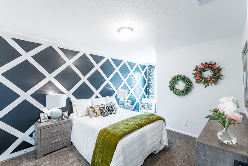7810 Bear Trace Road Fairview, TN 37062 - Photo 14 of 20 a bedroom with a bed and a potted plant