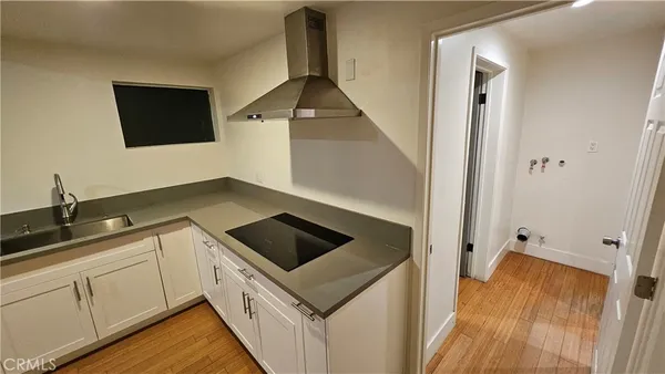a kitchen with a sink and cabinets