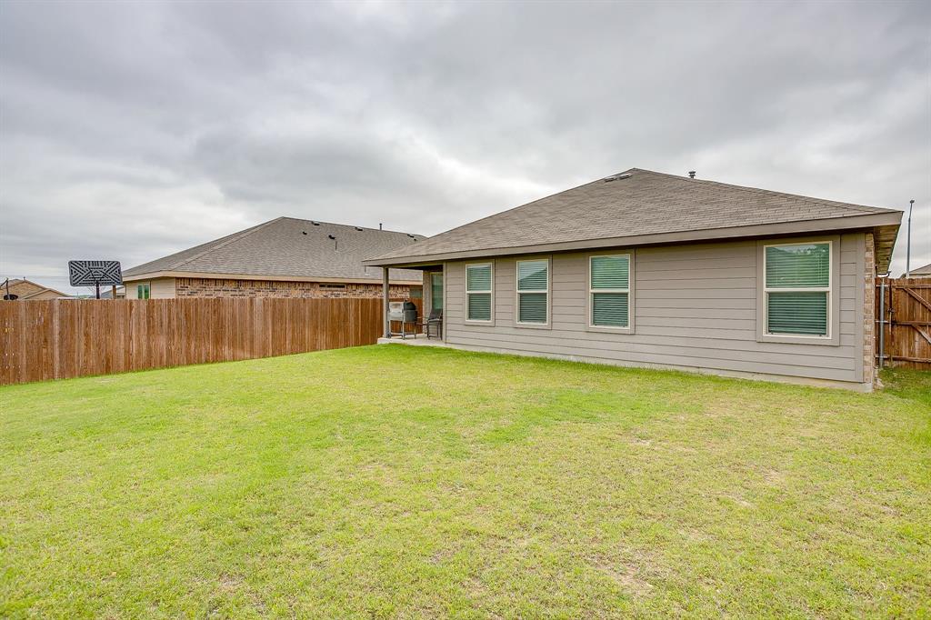 2313 Stallings Road Fort Worth, TX 76108 - Photo 29 of 30 a view of a house with backyard and wooden fence