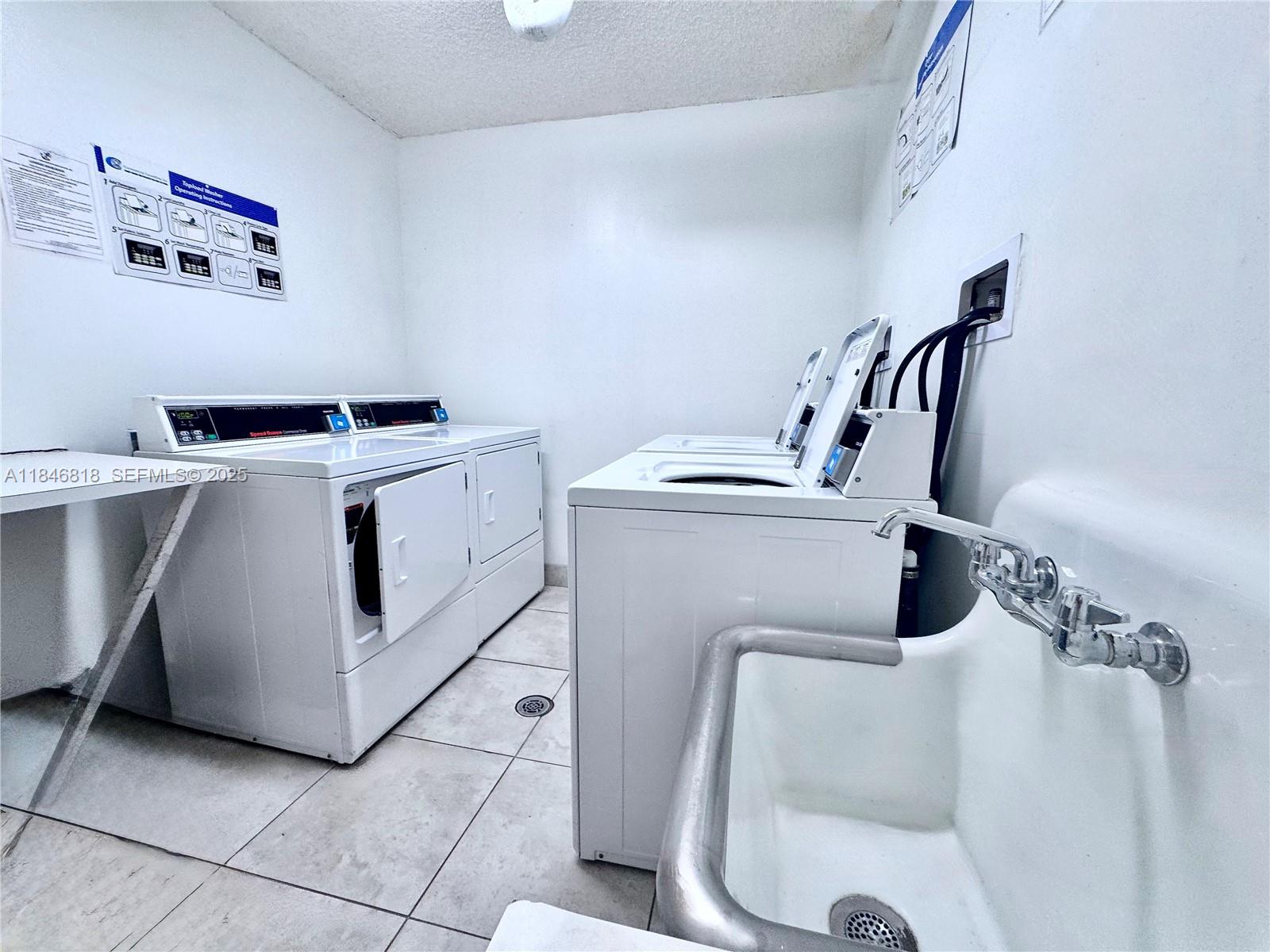 2851 Northeast 183rd Street, Unit 1508E Aventura, FL 33160 - Photo 16 of 27 a utility room with dryer and washer