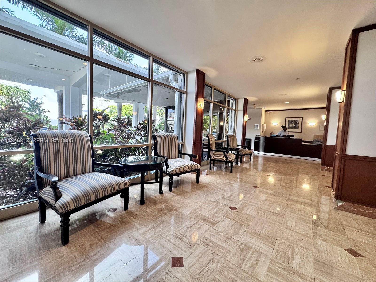 2851 Northeast 183rd Street, Unit 1508E Aventura, FL 33160 - Photo 20 of 27 a living room with furniture and a large window