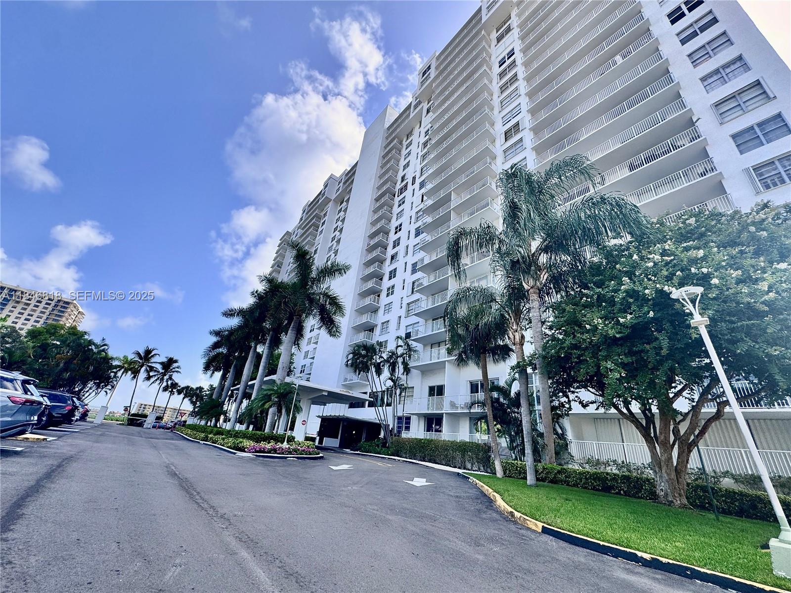 2851 Northeast 183rd Street, Unit 1508E Aventura, FL 33160 - Photo 23 of 27 a view of a street with a building in the background