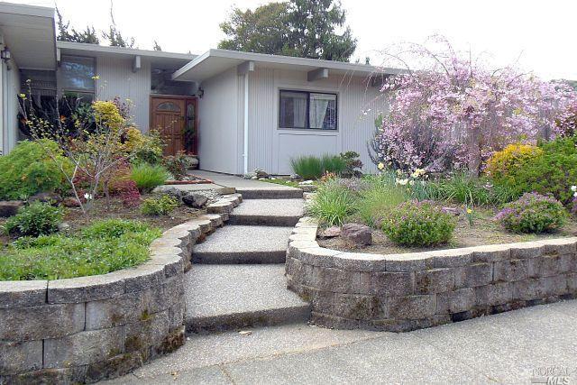 691 Del Ganado Road San Rafael, CA 94903 - Photo 1 of 1 a view of a house with a yard and potted plants