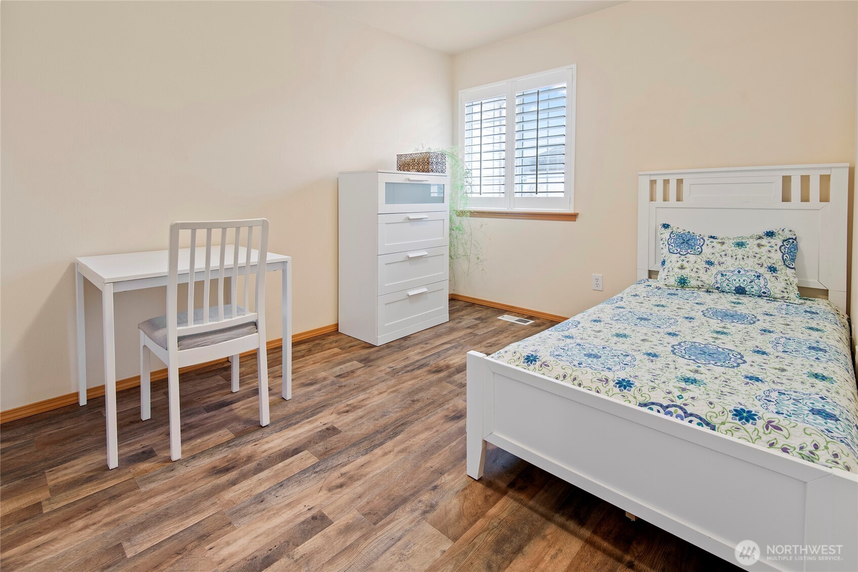 4023 160th Place Southeast Bothell, WA 98012 - Photo 20 of 22 a living room with a bed furniture and a wooden floor