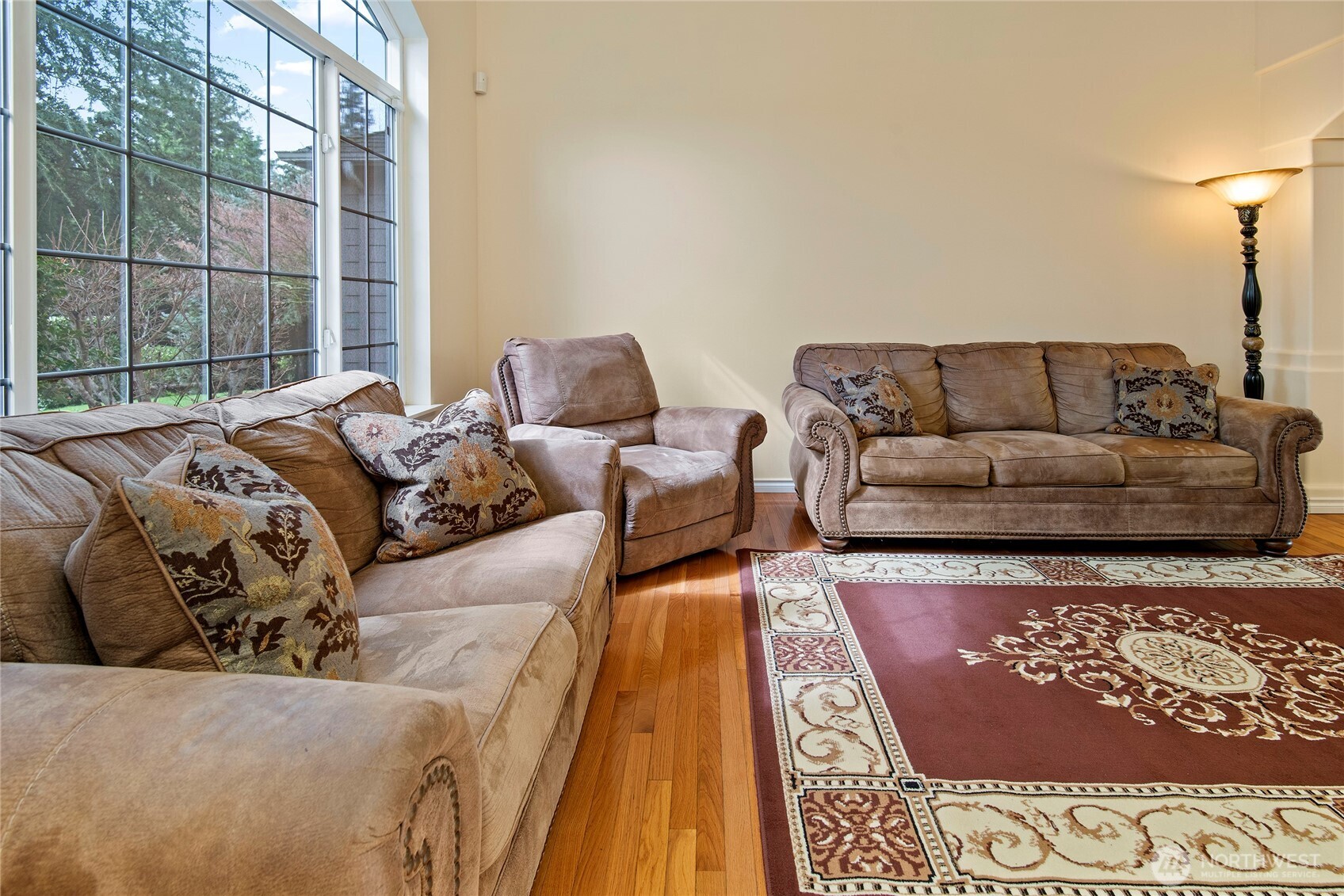 4023 160th Place Southeast Bothell, WA 98012 - Photo 3 of 22 a large bed sitting in a bedroom next to a window