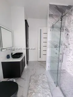 a kitchen with a refrigerator and a sink