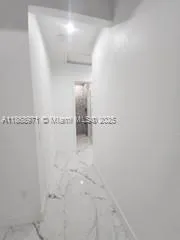 a kitchen with stainless steel appliances kitchen island granite countertop a sink and cabinets