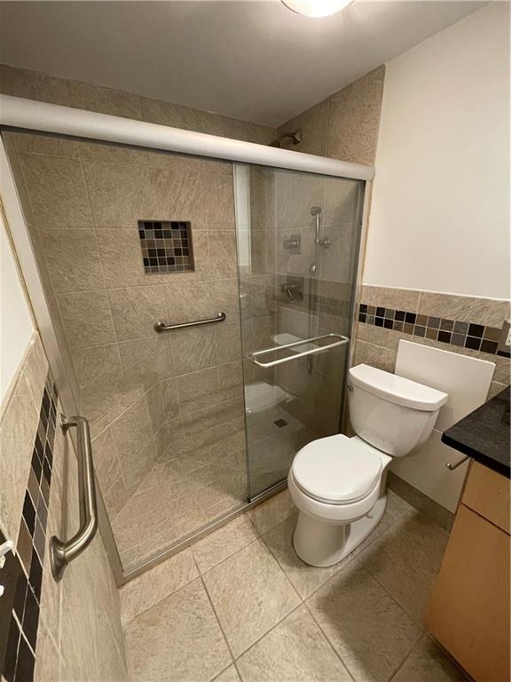 1501 Clairmont Road, Unit 532 Decatur, GA 30033 - Photo 12 of 17 a bathroom with a toilet and a shower