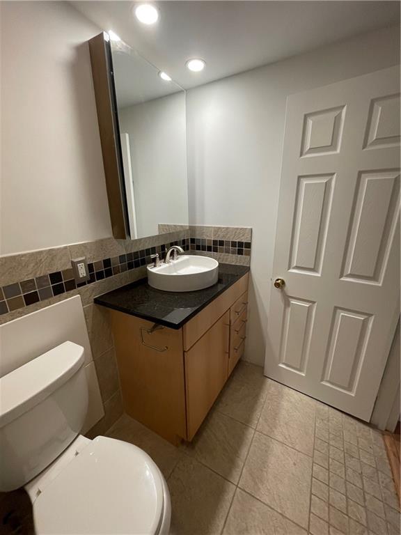 1501 Clairmont Road, Unit 532 Decatur, GA 30033 - Photo 4 of 17 a bathroom with a sink a toilet and mirror