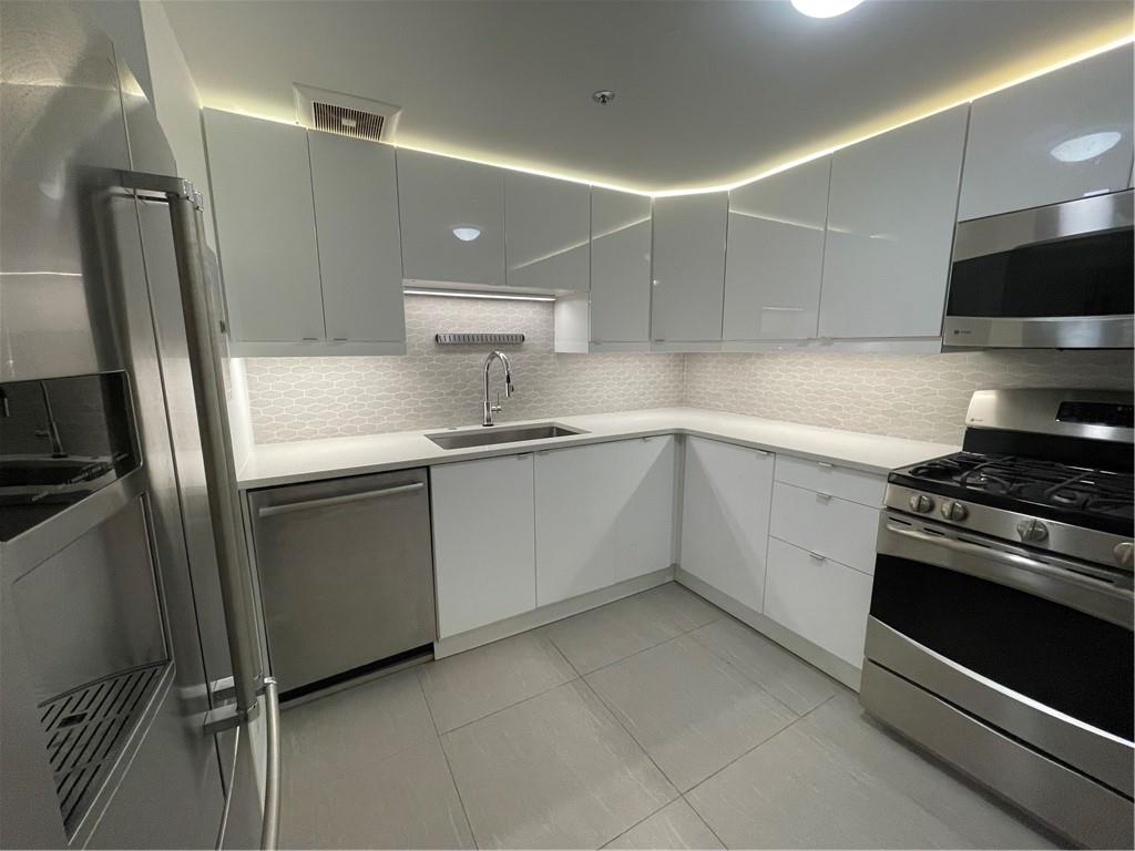 1501 Clairmont Road, Unit 532 Decatur, GA 30033 - Photo 6 of 17 a kitchen with a sink appliances and cabinets