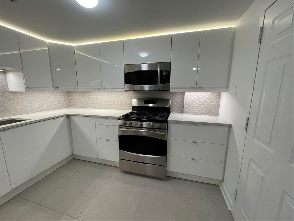 1501 Clairmont Road, Unit 532 Decatur, GA 30033 - Photo 7 of 17 a kitchen with stainless steel appliances a stove and a sink