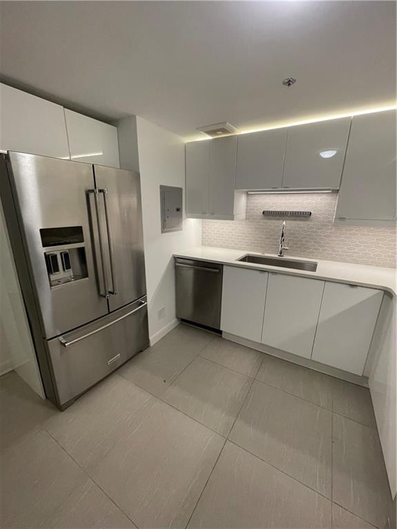 1501 Clairmont Road, Unit 532 Decatur, GA 30033 - Photo 8 of 17 a kitchen with stainless steel appliances a sink and a refrigerator