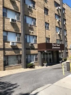 a kitchen with a stove a refrigerator and cabinets