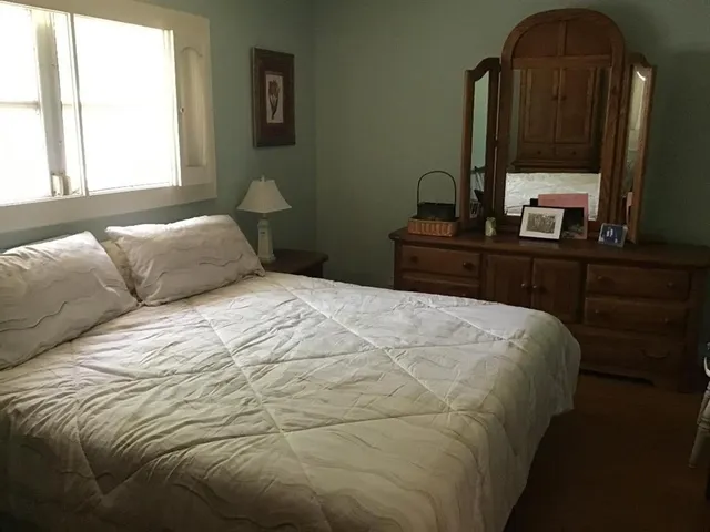a white toilet sitting next to a bathroom sink