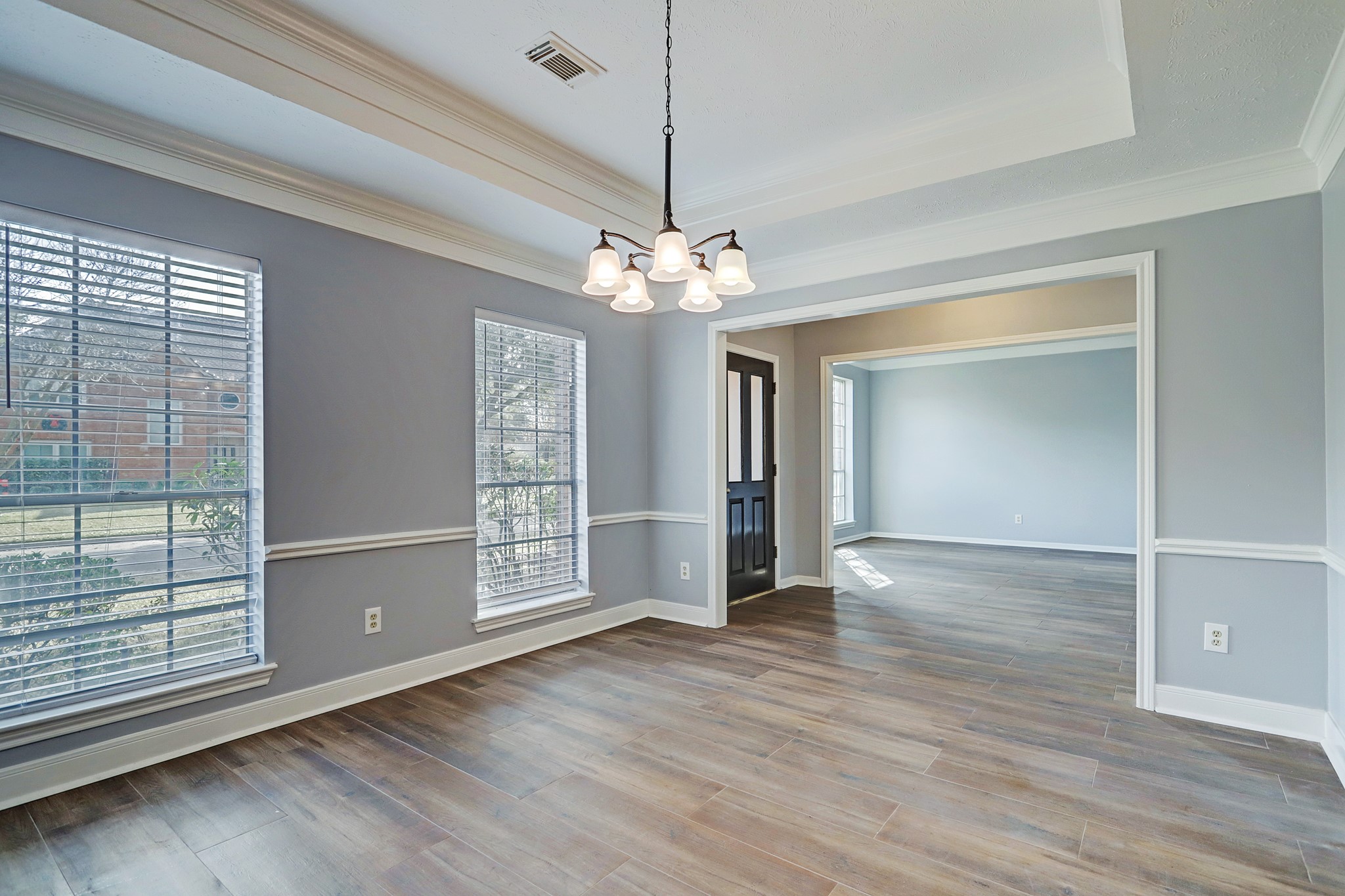 7403 Manor Bridge Court Houston, TX 77095 - Photo 2 of 11 a view of an empty room with wooden floor and a window