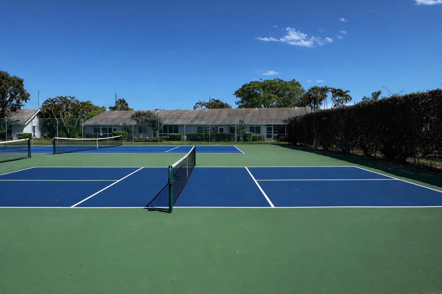 2840 Casa Way, Unit 201 Delray Beach, FL 33445 - Photo 17 of 26 a view of outdoor space and tennis court