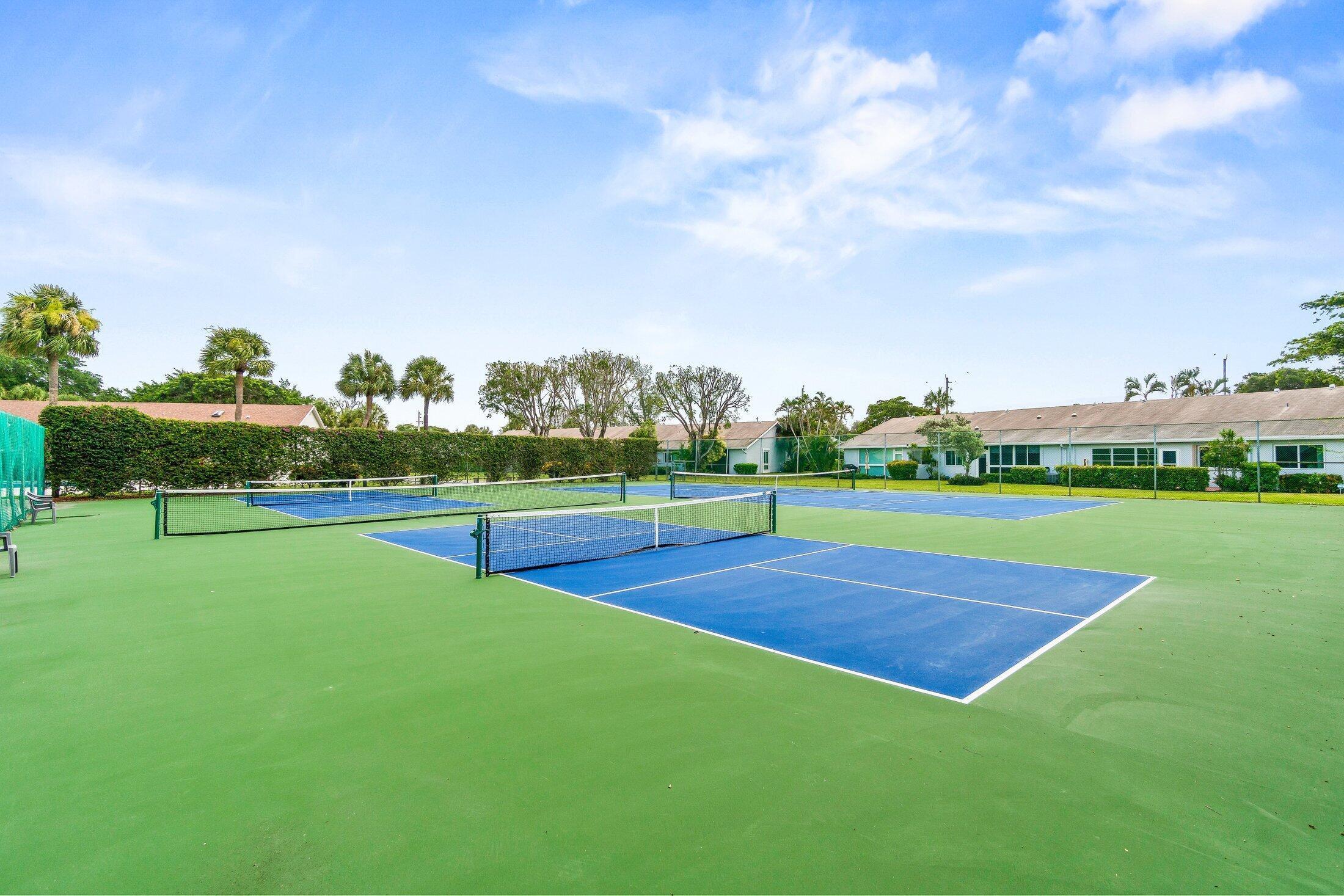 2840 Casa Way, Unit 201 Delray Beach, FL 33445 - Photo 18 of 26 a view of a big yard with swimming pool and green space