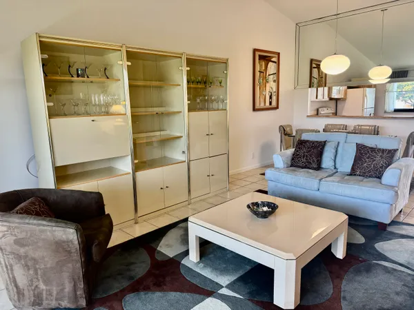 a living room with furniture and a table