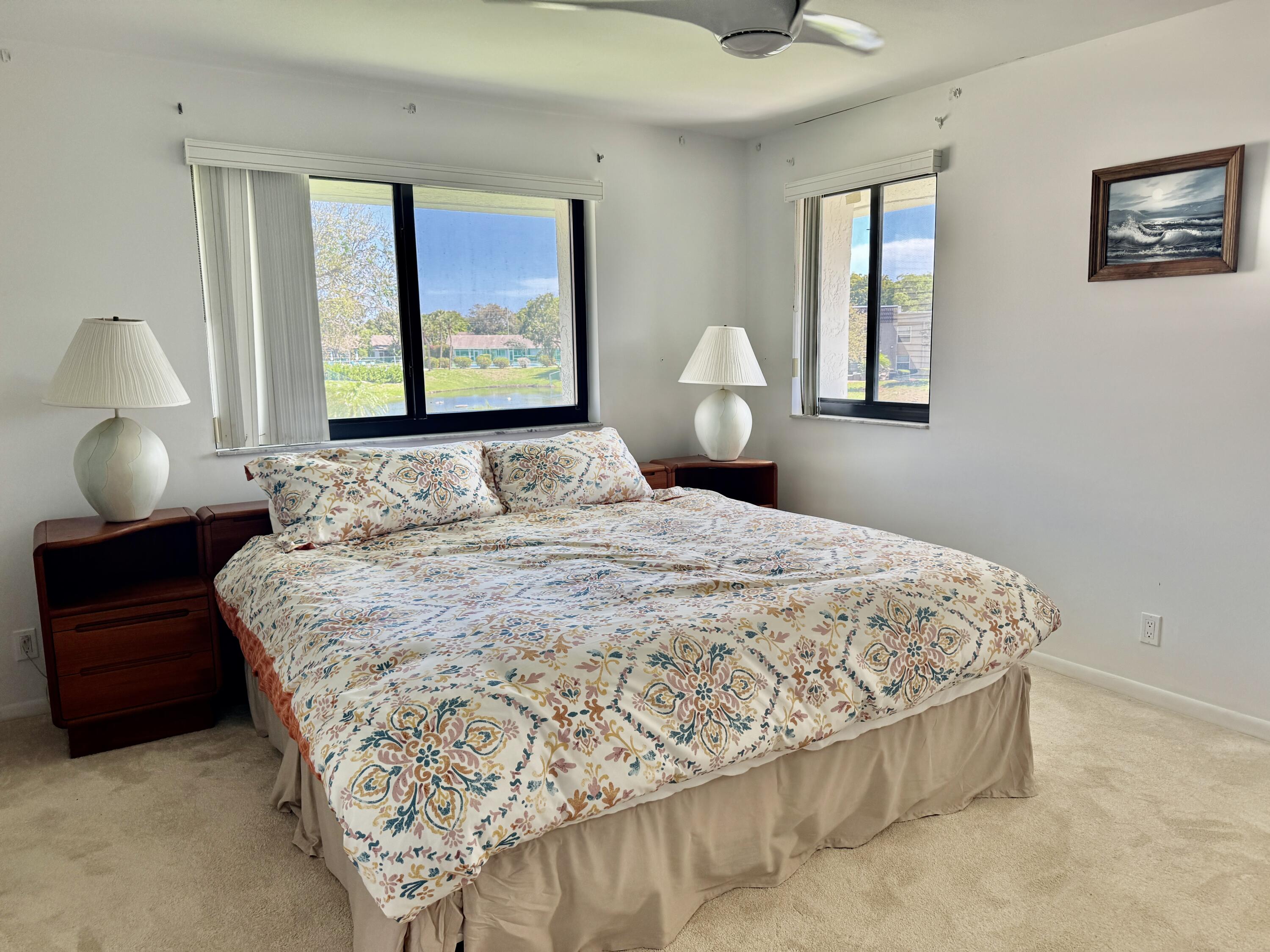 2840 Casa Way, Unit 201 Delray Beach, FL 33445 - Photo 10 of 26 a bedroom with a bed and window