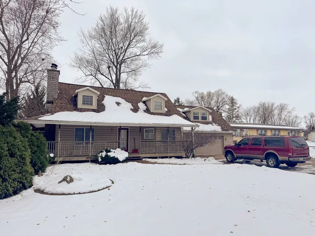 a front view of a house with yard