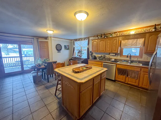 a kitchen with a stove top oven sink and cabinets