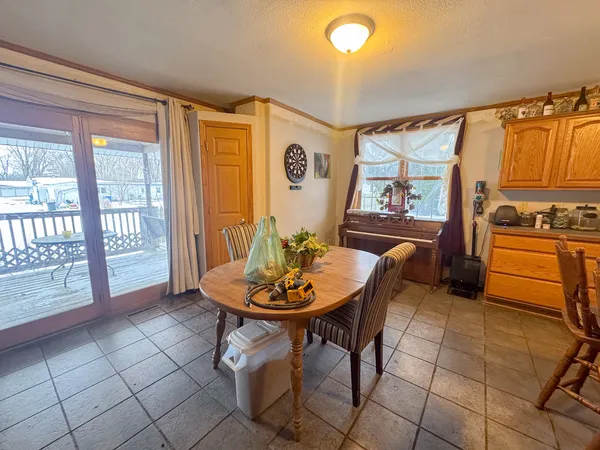 a view of a dining room with furniture and window