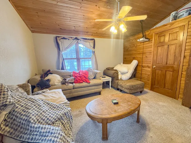 a living room with furniture and a table